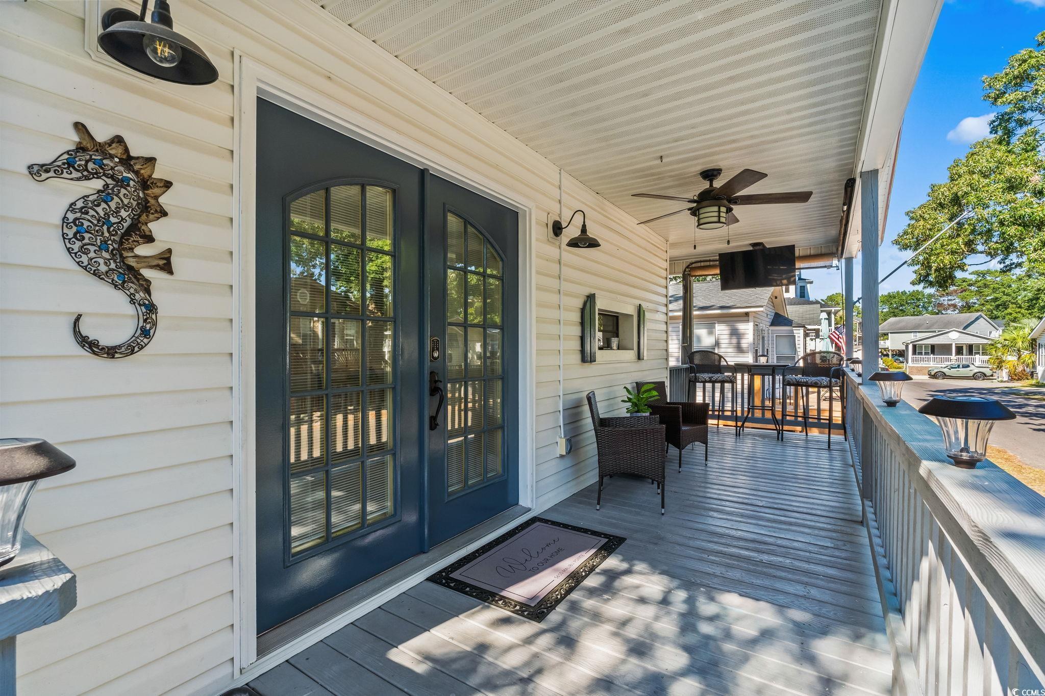 Image 2: Wooden terrace featuring ceiling fan Image 2: Wooden terrace featuring ceiling fan