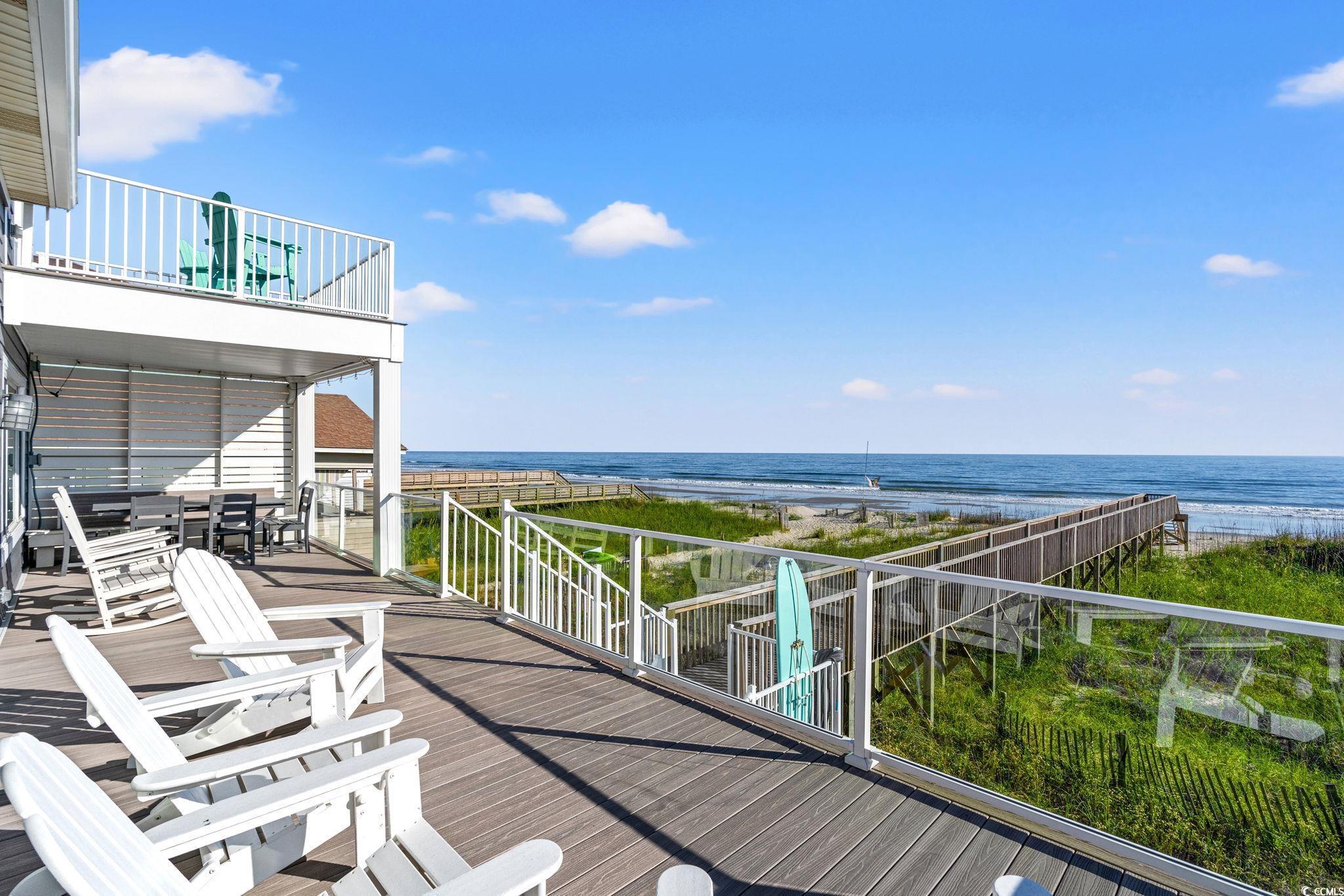 Image 2: Amazing deck space overlooking the ocean .