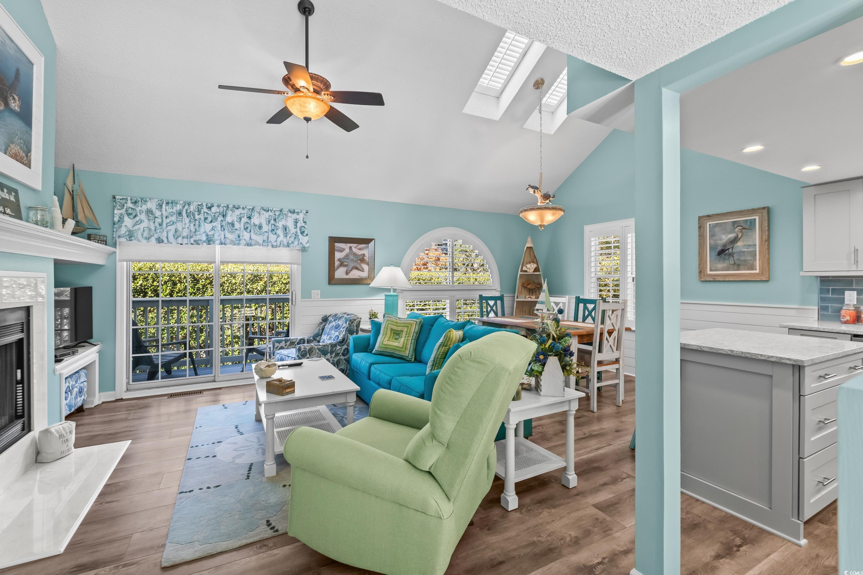 Image 3: Living area with a skylight, a premium fireplace, Image 3: Living area with a skylight, a premium fireplace,