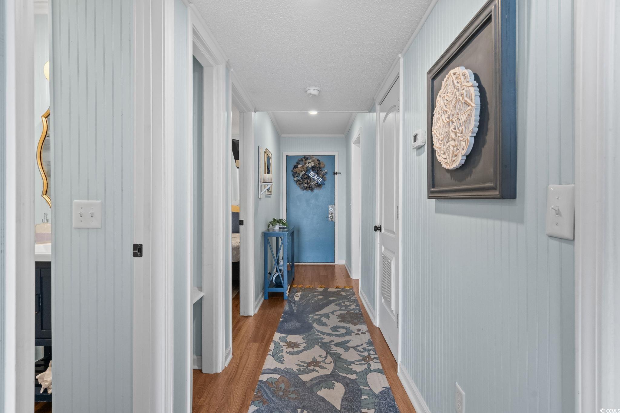 Image 3: Corridor featuring wood finished floors and a text Image 3: Corridor featuring wood finished floors and a text