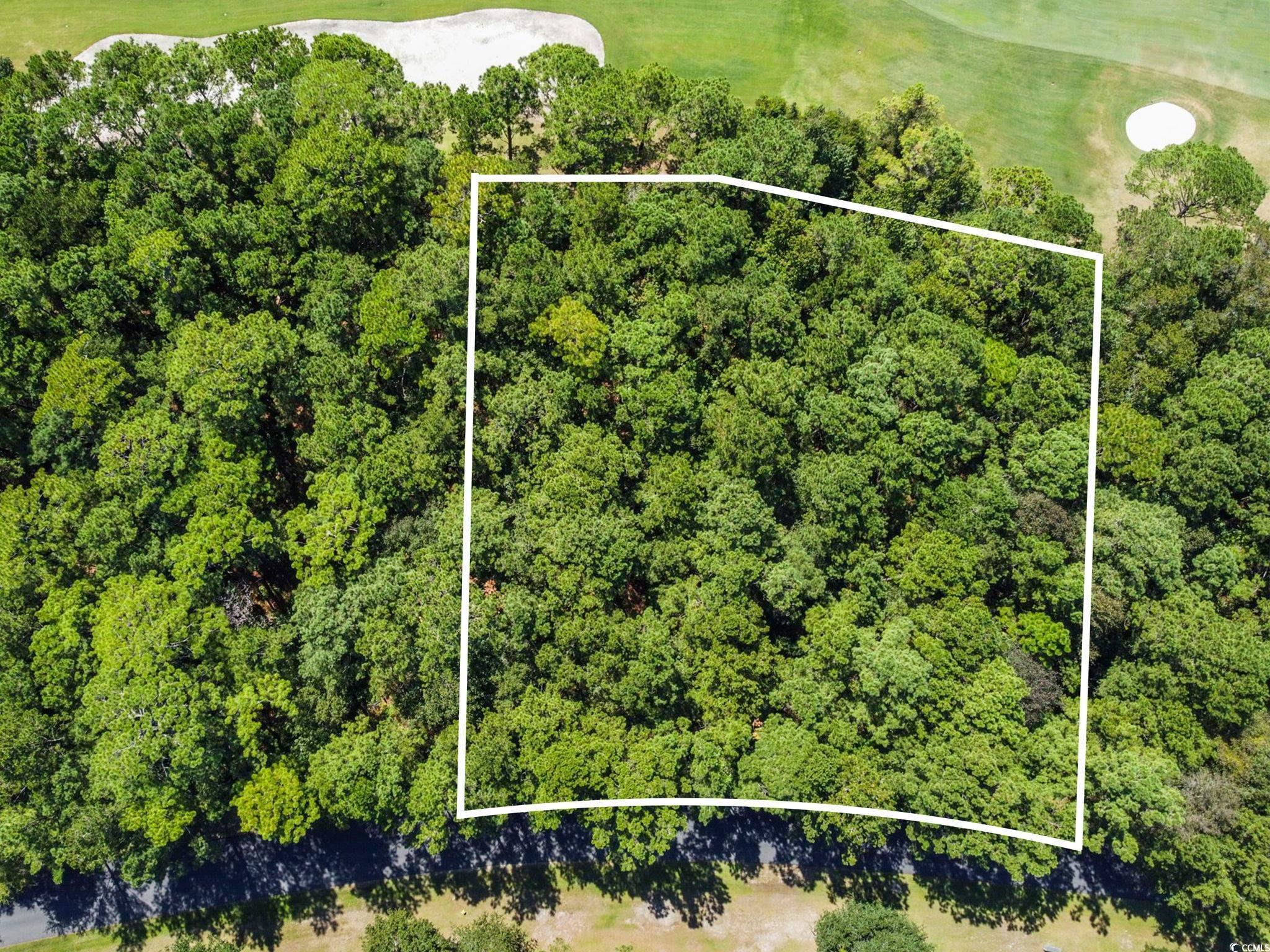 Image 1: Aerial overview of property's location featuring p
