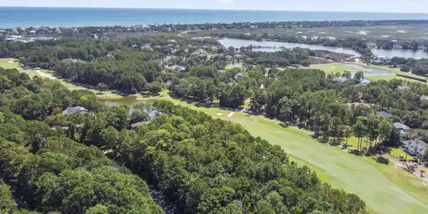 Image 3: Aerial view of a large body of water and a golf co Image 3: Aerial view of a large body of water and a golf co