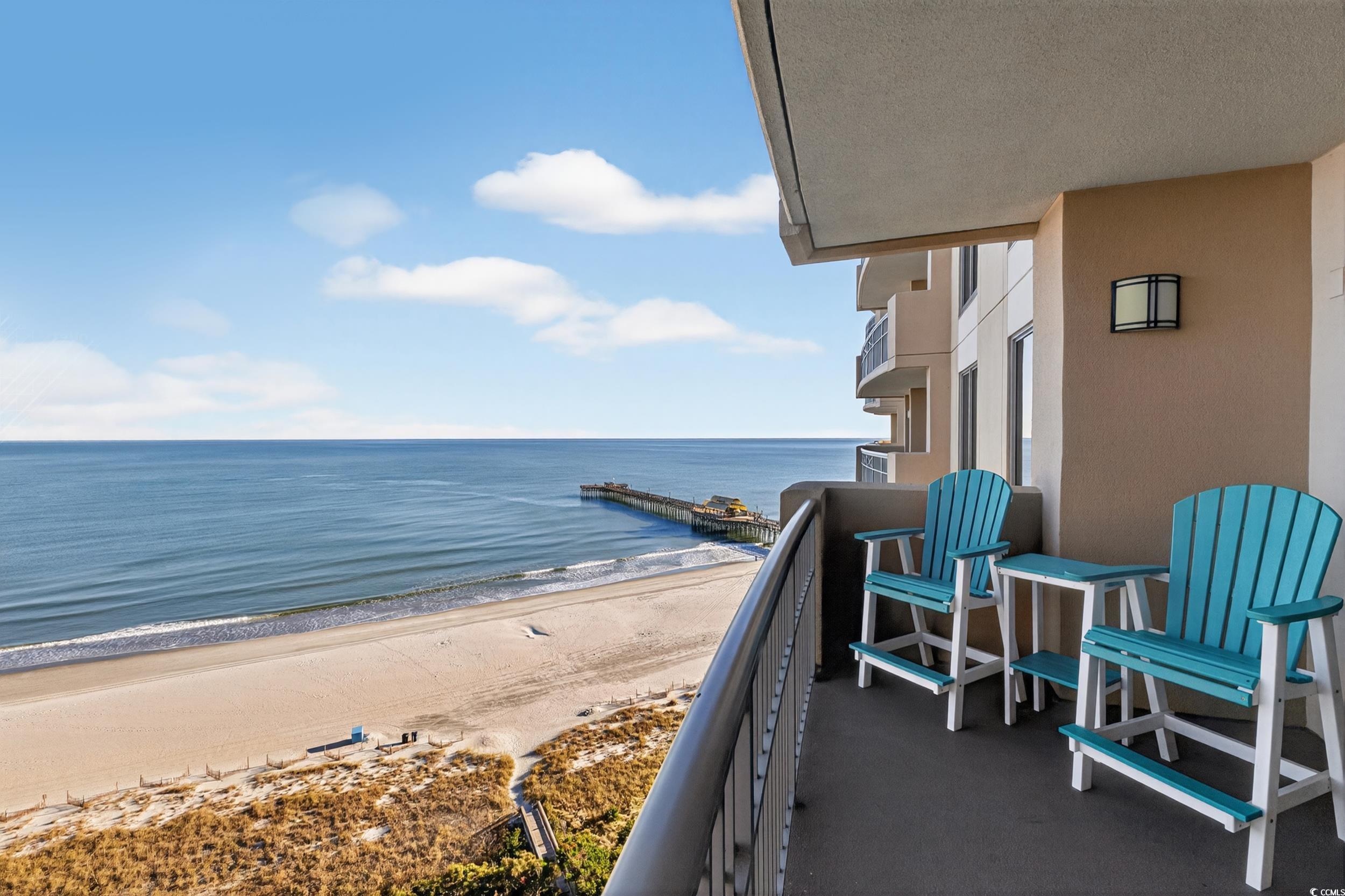 Image 3: Balcony with view of water and beach