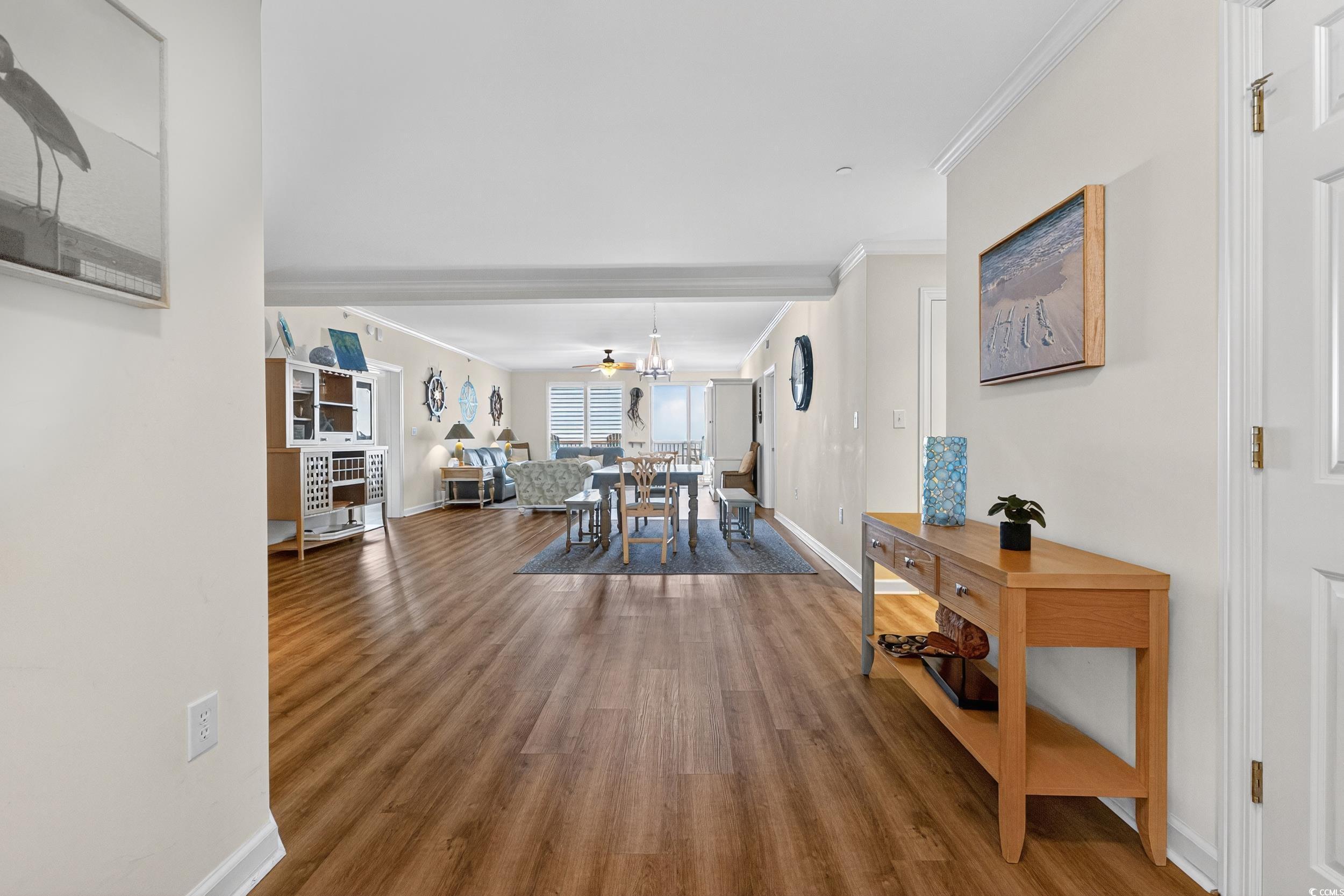 Image 4: Dining room featuring ornamental molding, wood fin