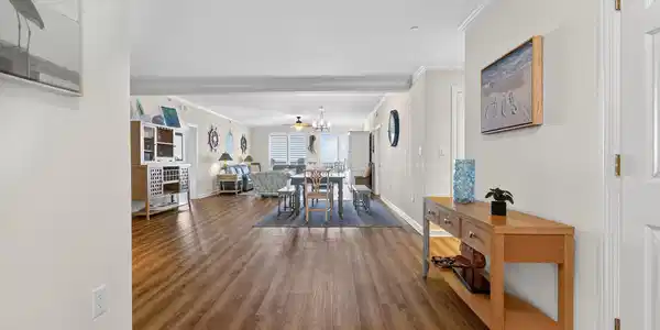 Image 4: Dining room featuring ornamental molding, wood fin