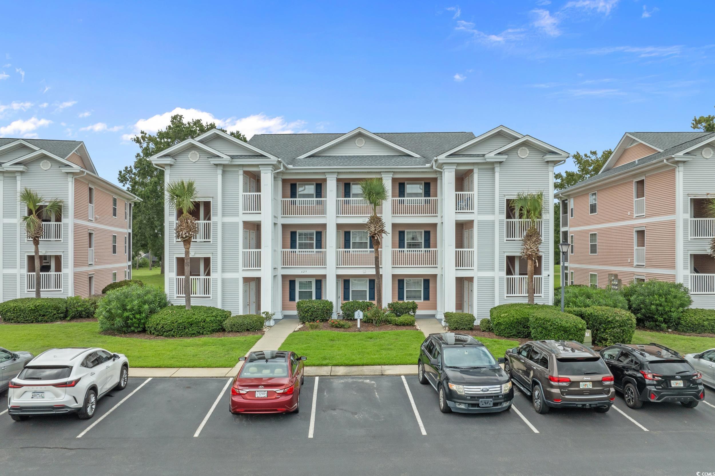 Image 1: View of apartment building / complex featuring unc