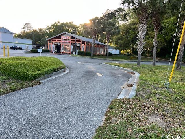 Image 2: View of road featuring curbs