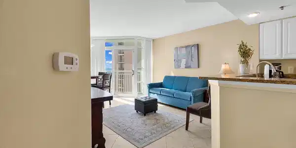 Image 3: Living area with a textured ceiling, expansive win Image 3: Living area with a textured ceiling, expansive win