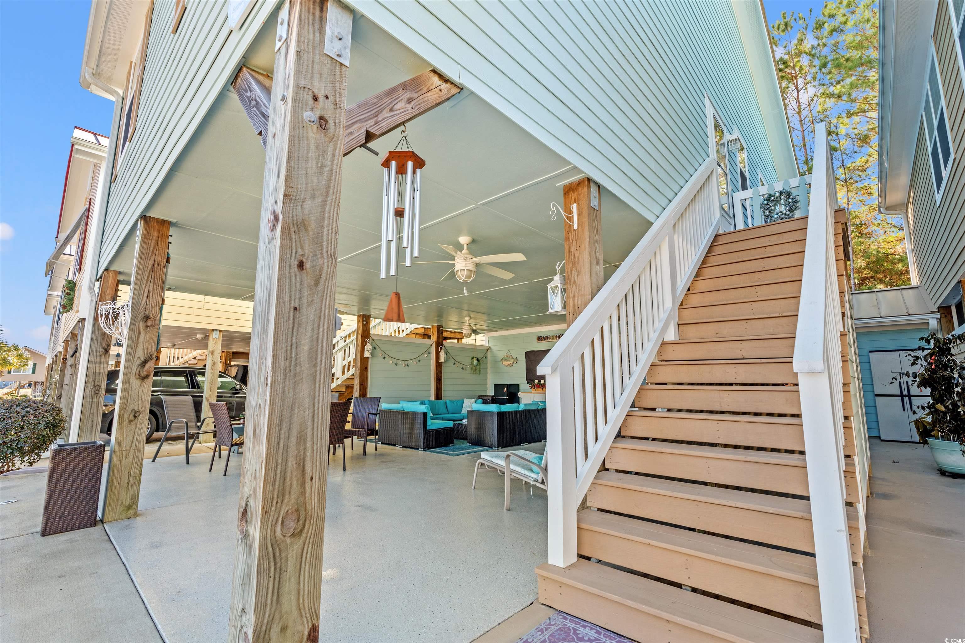 Image 2: View of patio / terrace featuring stairway, an out