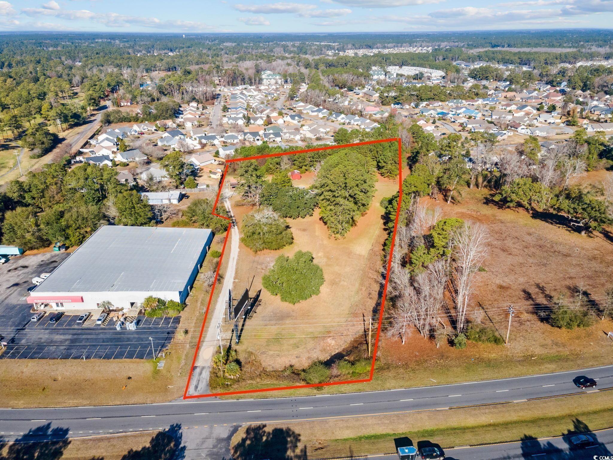 Image 1: Aerial overview of property's location with proper