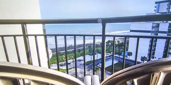 Image 2: Balcony featuring view of water and beach