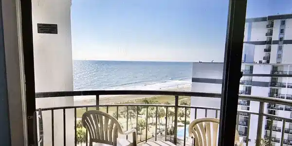 Image 4: Balcony with view of water and beach