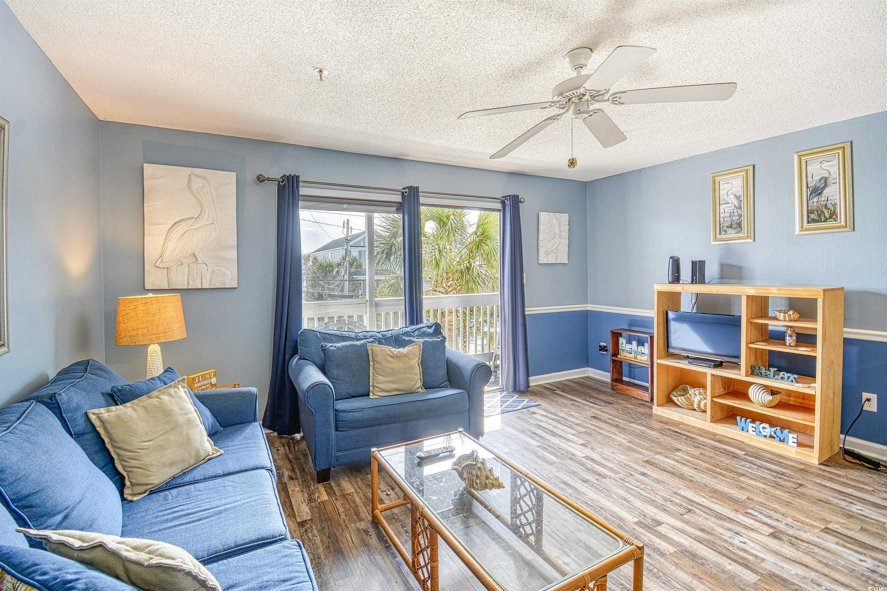 Image 3: Living room featuring hardwood / wood-style floori Image 3: Living room featuring hardwood / wood-style floori