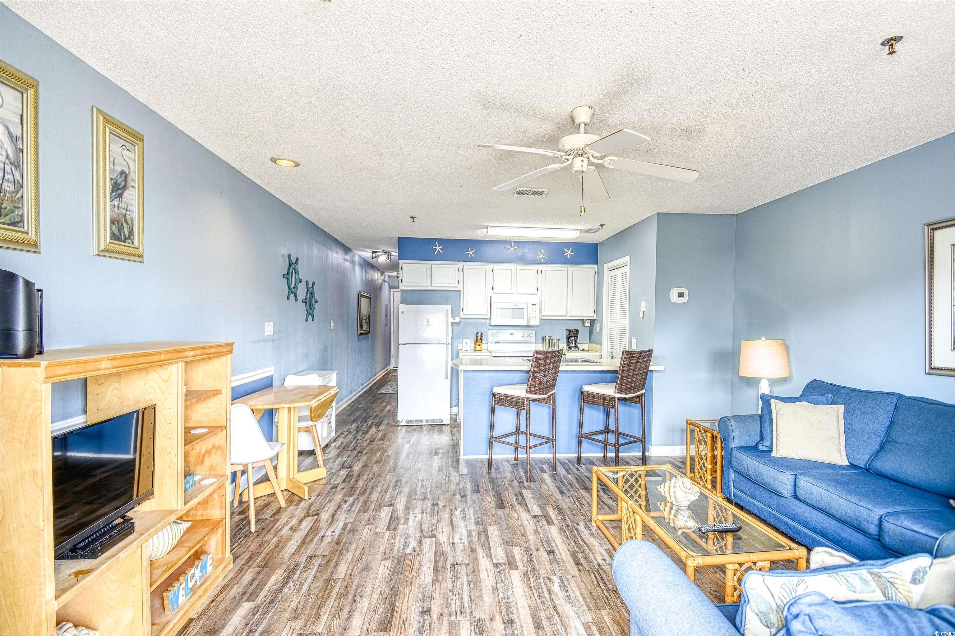 Image 4: Living room with ceiling fan, a textured ceiling, Image 4: Living room with ceiling fan, a textured ceiling,
