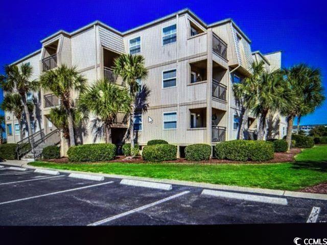Image 1: View of apartment building / complex featuring unc Image 1: View of apartment building / complex featuring unc
