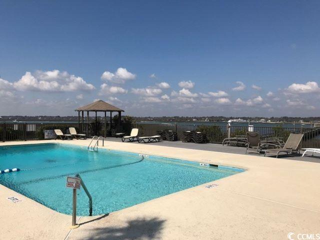 Image 4: Community pool featuring a patio area and a gazebo Image 4: Community pool featuring a patio area and a gazebo