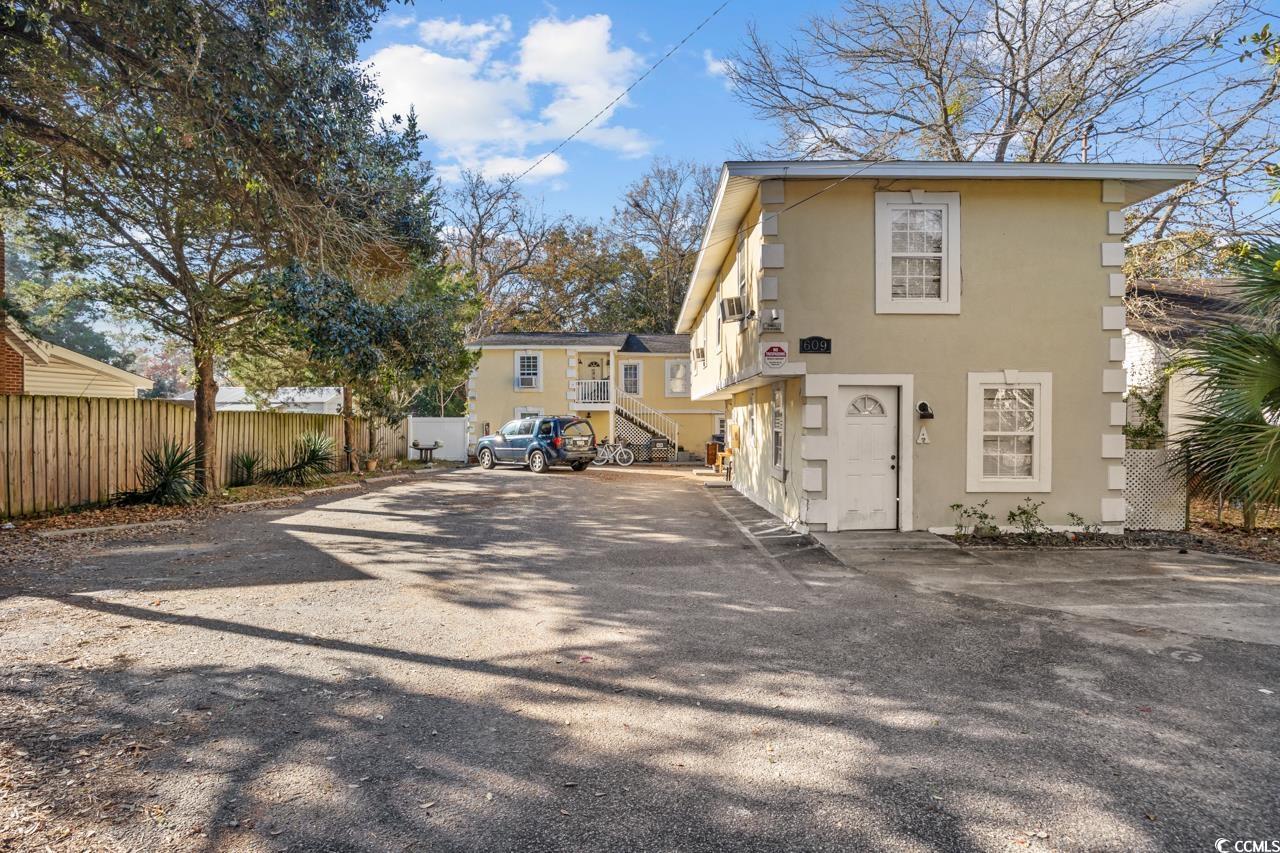 Image 1: Back of property featuring stucco siding Image 1: Back of property featuring stucco siding