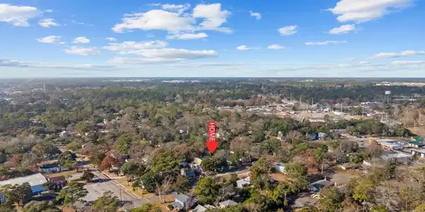 Image 4: Aerial view of property's location with a heavily