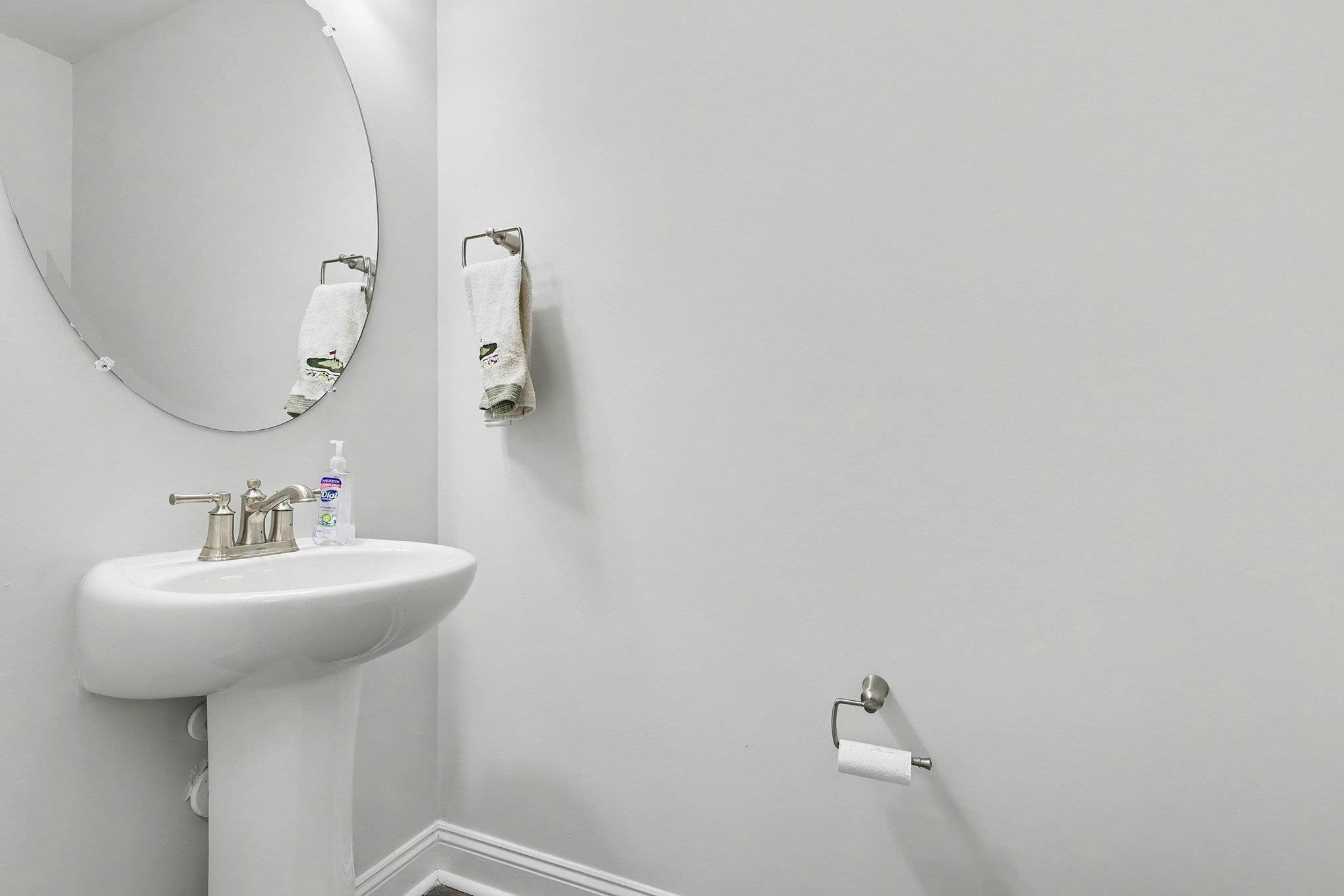Image 4: Bathroom featuring baseboards and a sink Image 4: Bathroom featuring baseboards and a sink