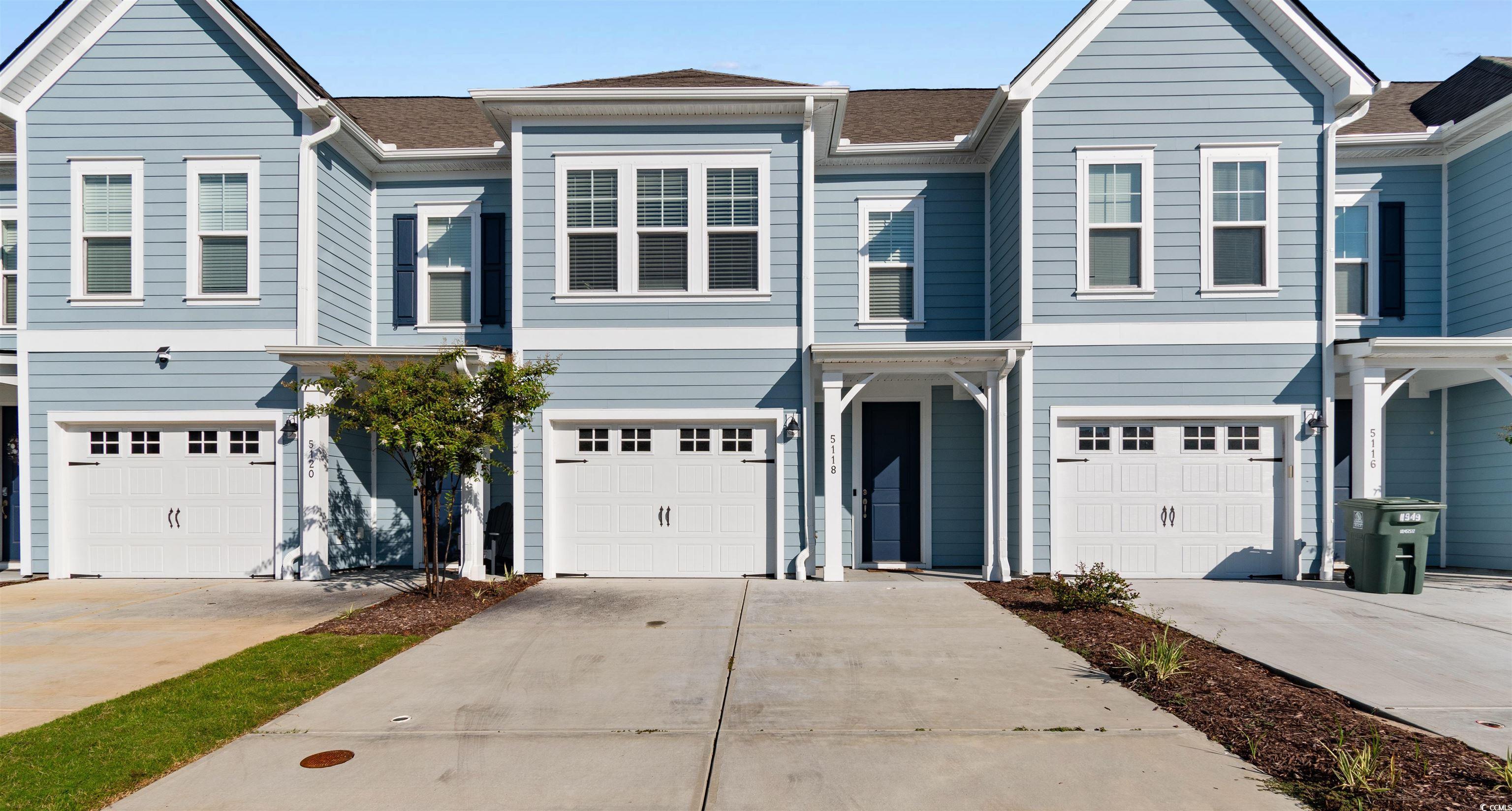 Image 1: Traditional home with concrete driveway, roof with Image 1: Traditional home with concrete driveway, roof with