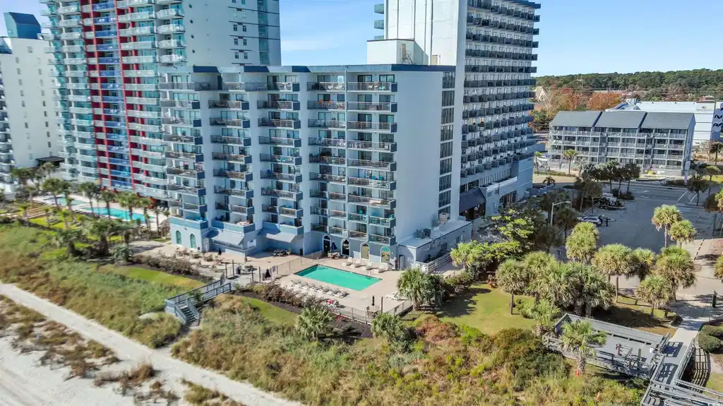 Image 1: View of urban area with a pool and apartment compl