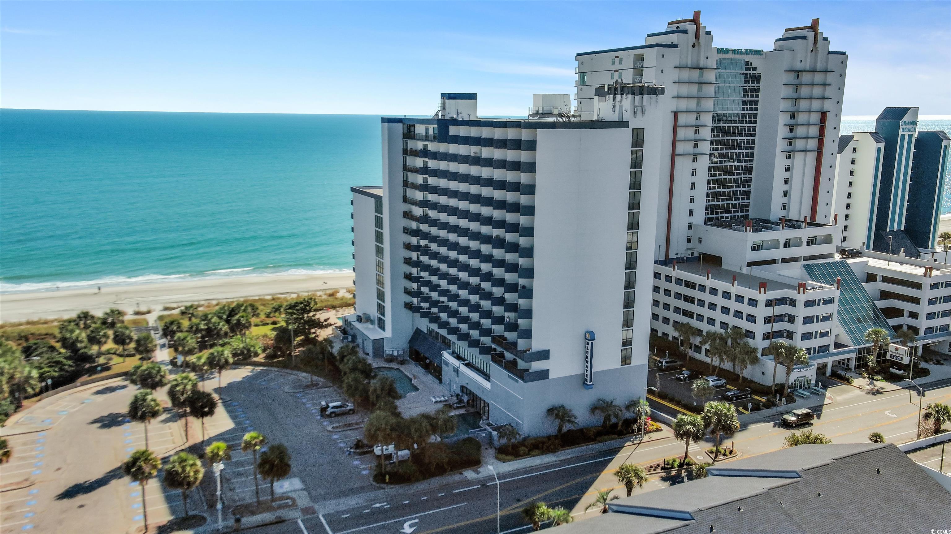 Image 3: Bird's eye view of expansive coastline and apartme Image 3: Bird's eye view of expansive coastline and apartme