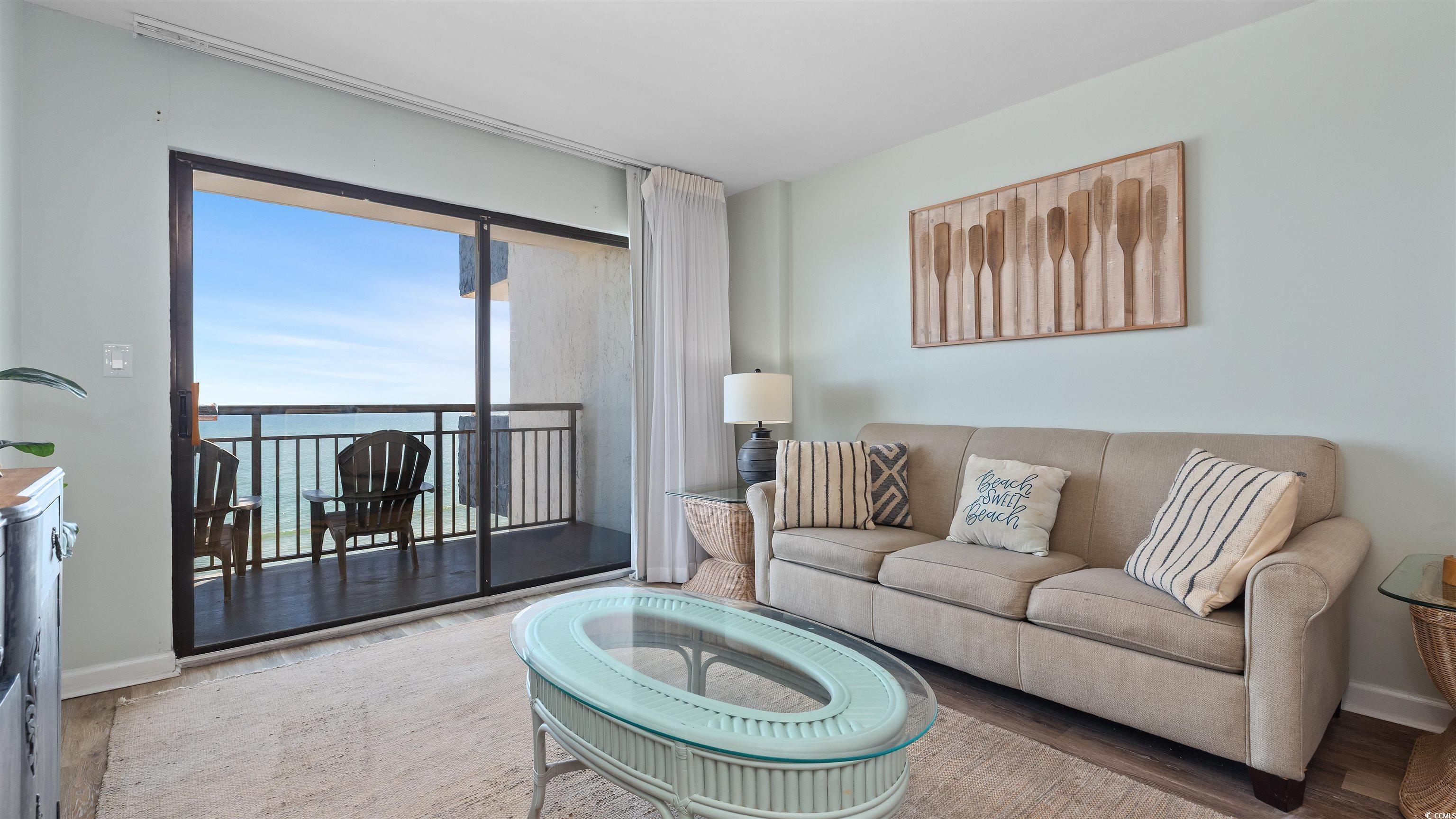 Image 4: Living room featuring wood finished floors and a w Image 4: Living room featuring wood finished floors and a w