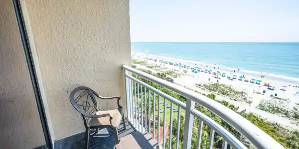 Image 3: Balcony with a water view and a beach view