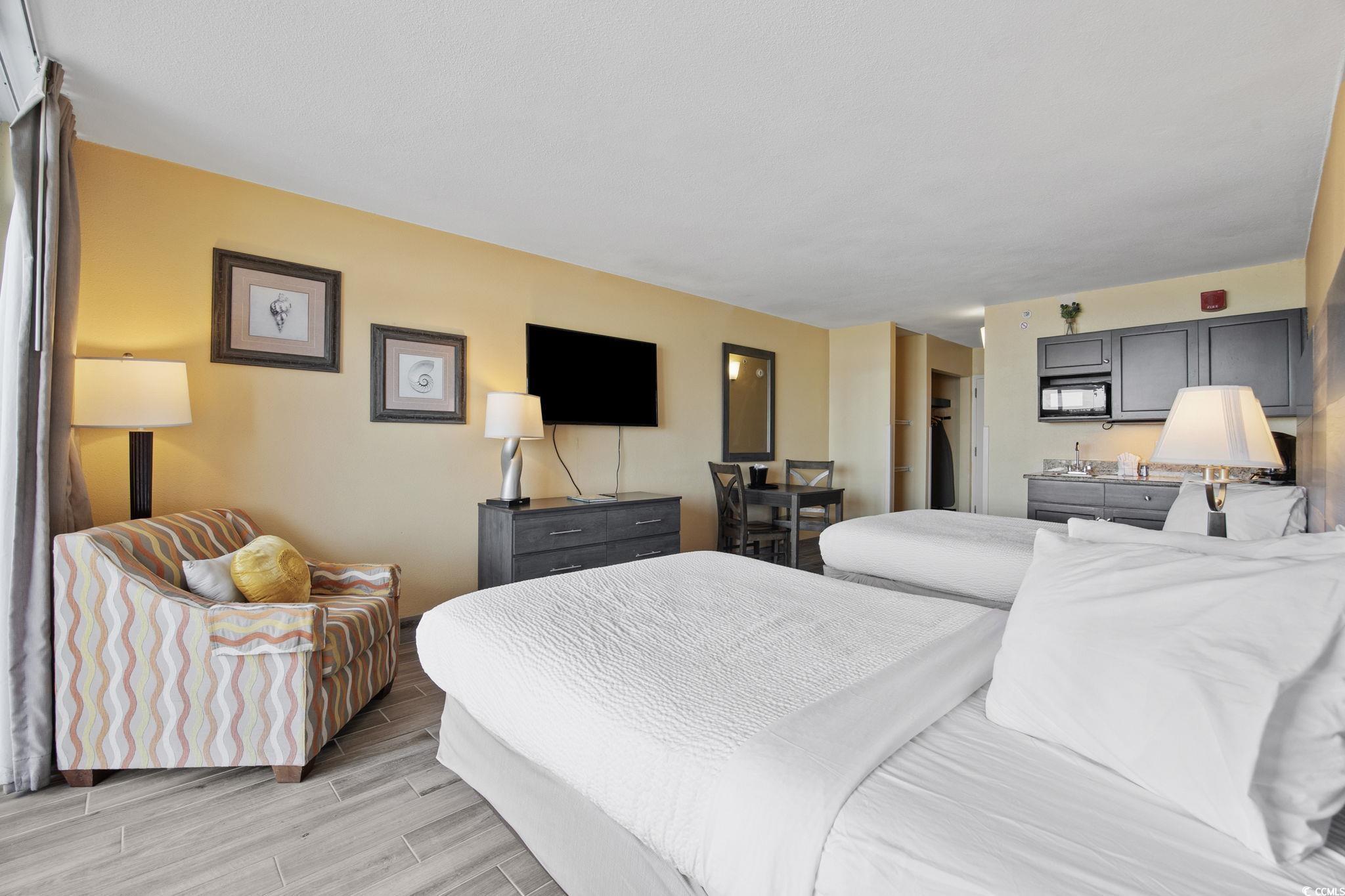 Image 3: Bedroom with wood finish floors