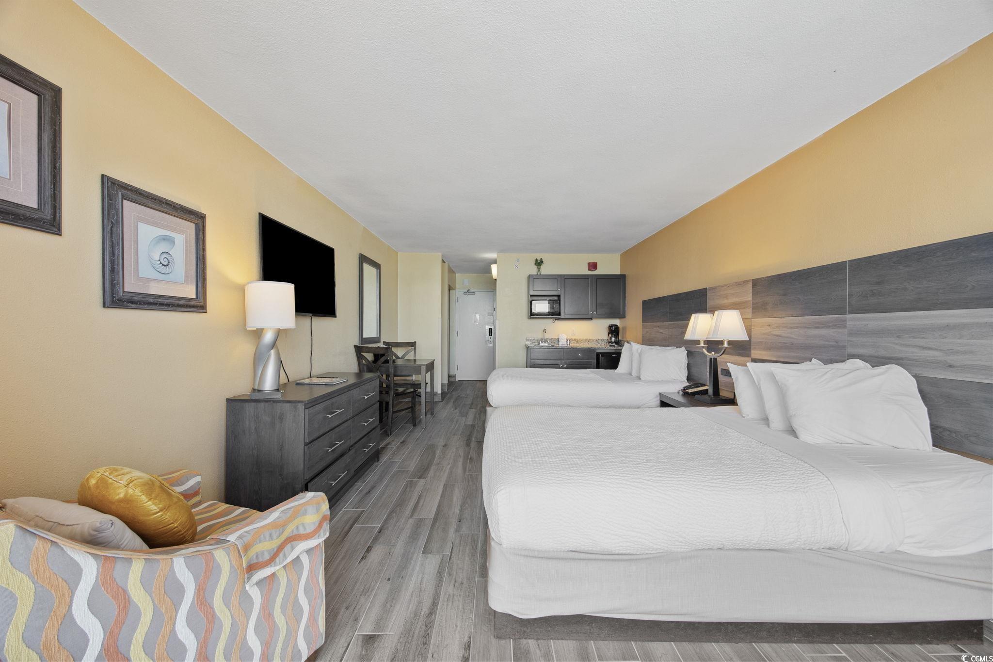 Image 4: Bedroom featuring wood finished floors