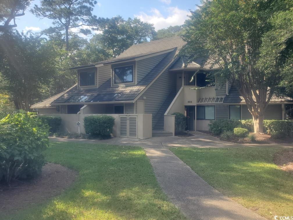 Image 1: View of front of home with a balcony and a front l Image 1: View of front of home with a balcony and a front l