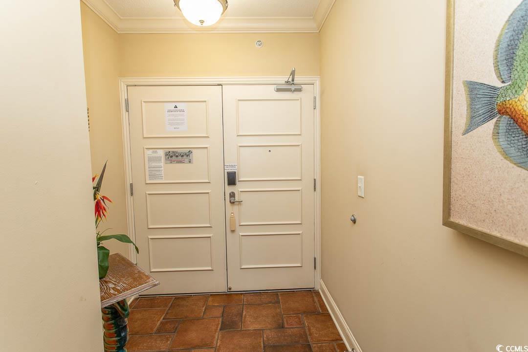 Image 3: Entryway featuring ornamental molding and dark sto Image 3: Entryway featuring ornamental molding and dark sto