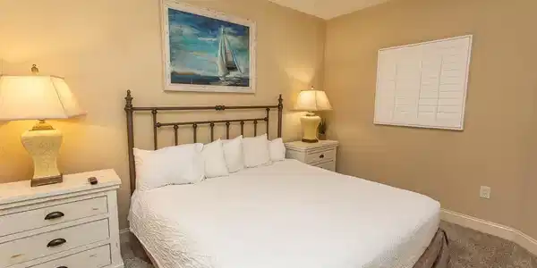 Image 4: Carpeted bedroom featuring baseboards and a ceilin Image 4: Carpeted bedroom featuring baseboards and a ceilin