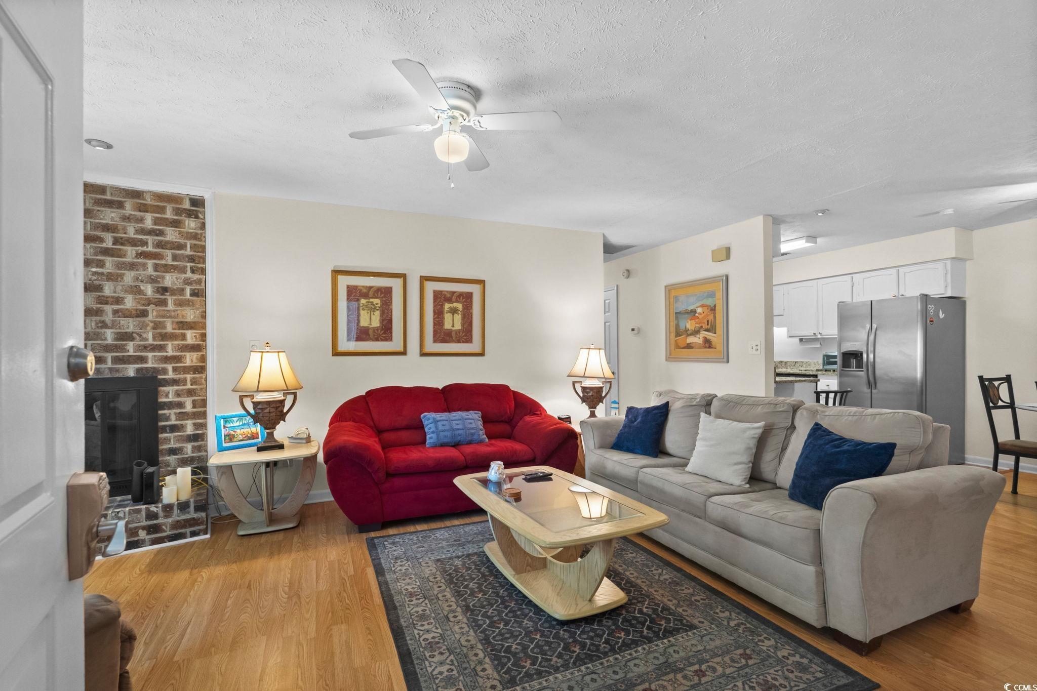 Image 3: Living area featuring light wood finished floors, Image 3: Living area featuring light wood finished floors,