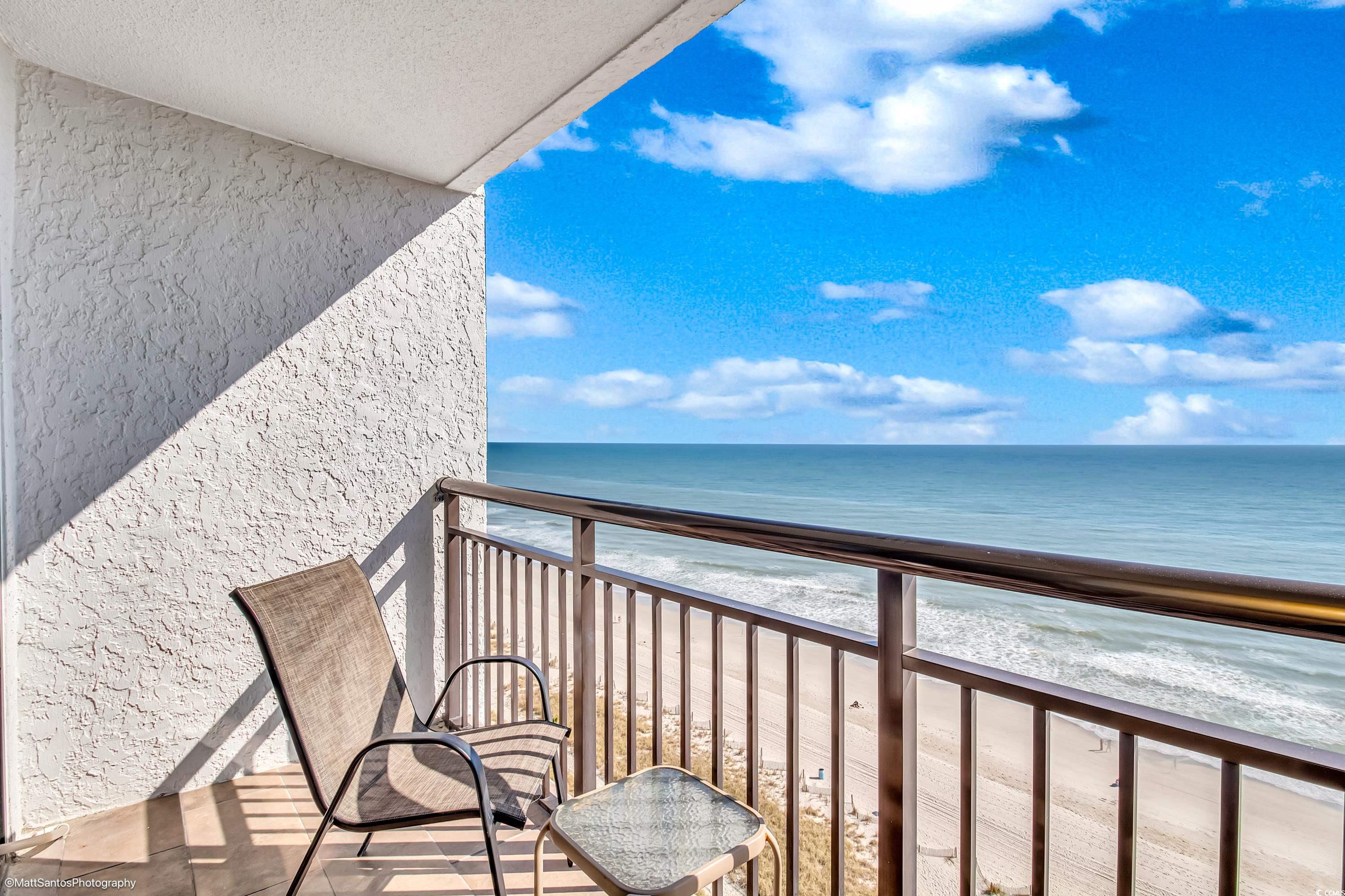 Image 3: Balcony featuring view of water and beach
