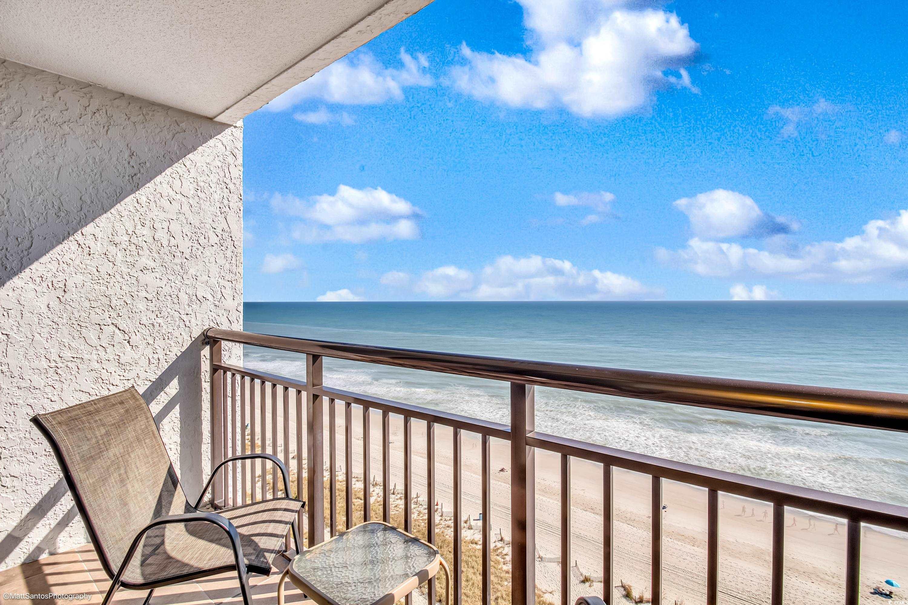 Image 4: Balcony with view of water and beach