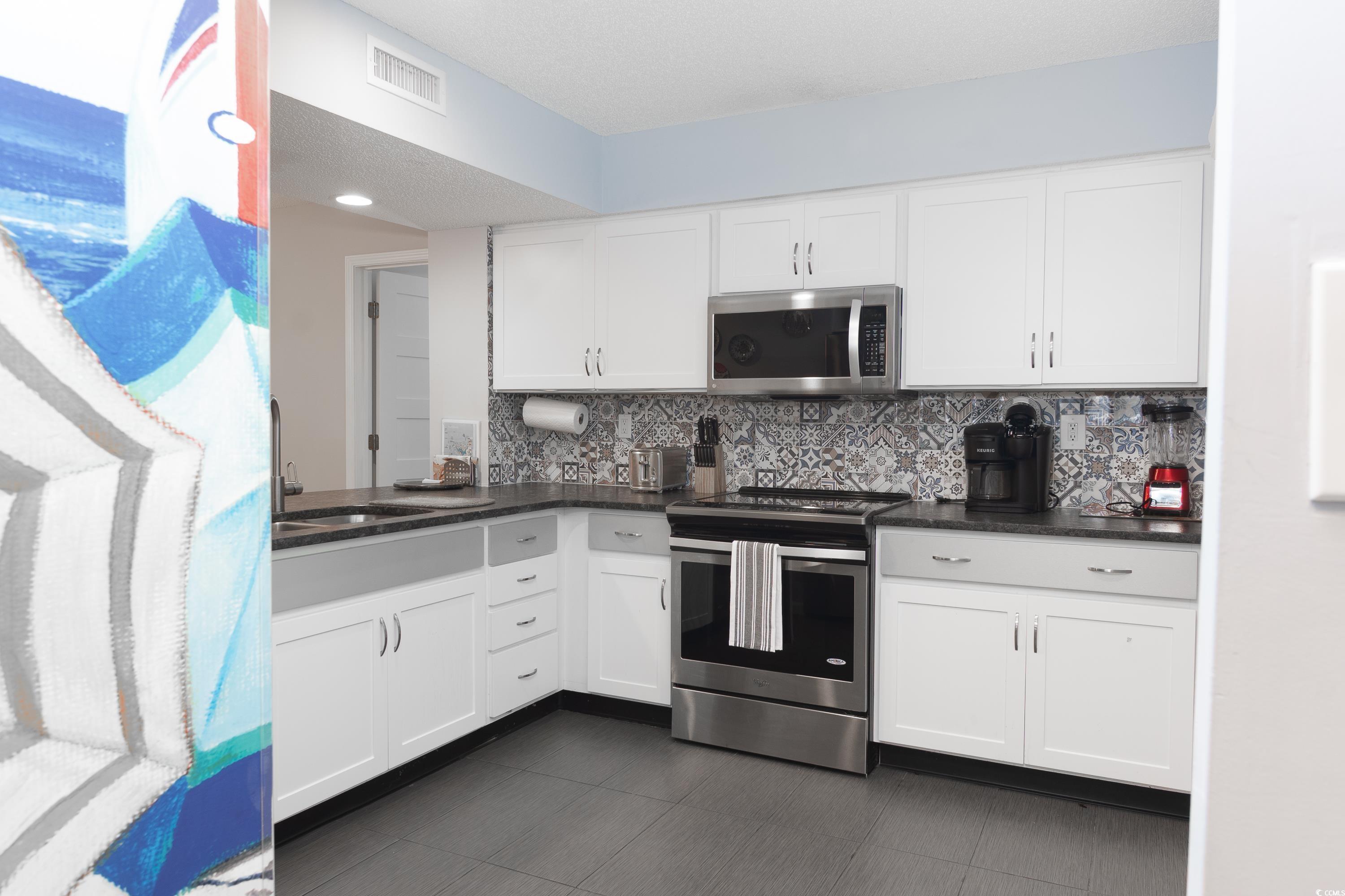 Image 3: Kitchen featuring stainless steel appliances, whit Image 3: Kitchen featuring stainless steel appliances, whit
