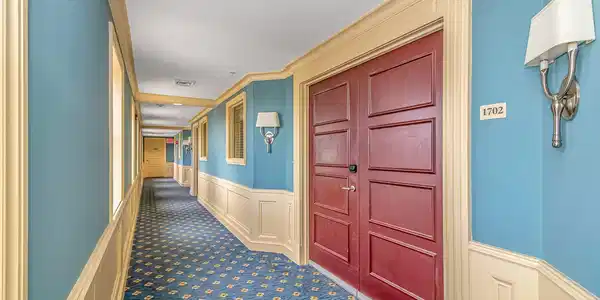 Image 2: Hallway featuring carpet, a wainscoted wall, and v Image 2: Hallway featuring carpet, a wainscoted wall, and v