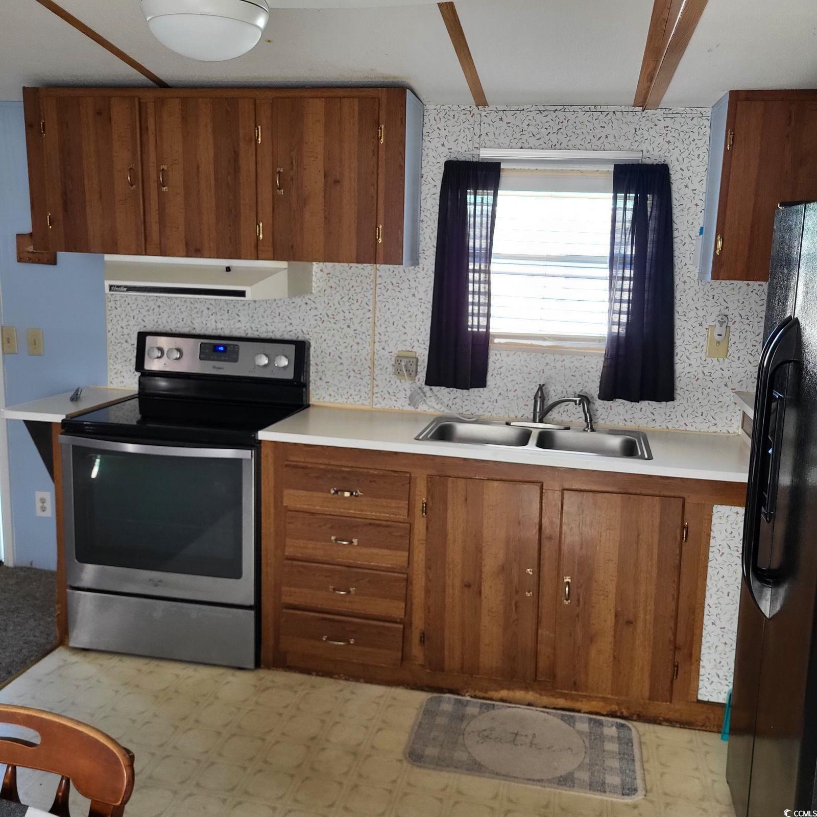 Image 4: Kitchen featuring stainless steel electric range o
