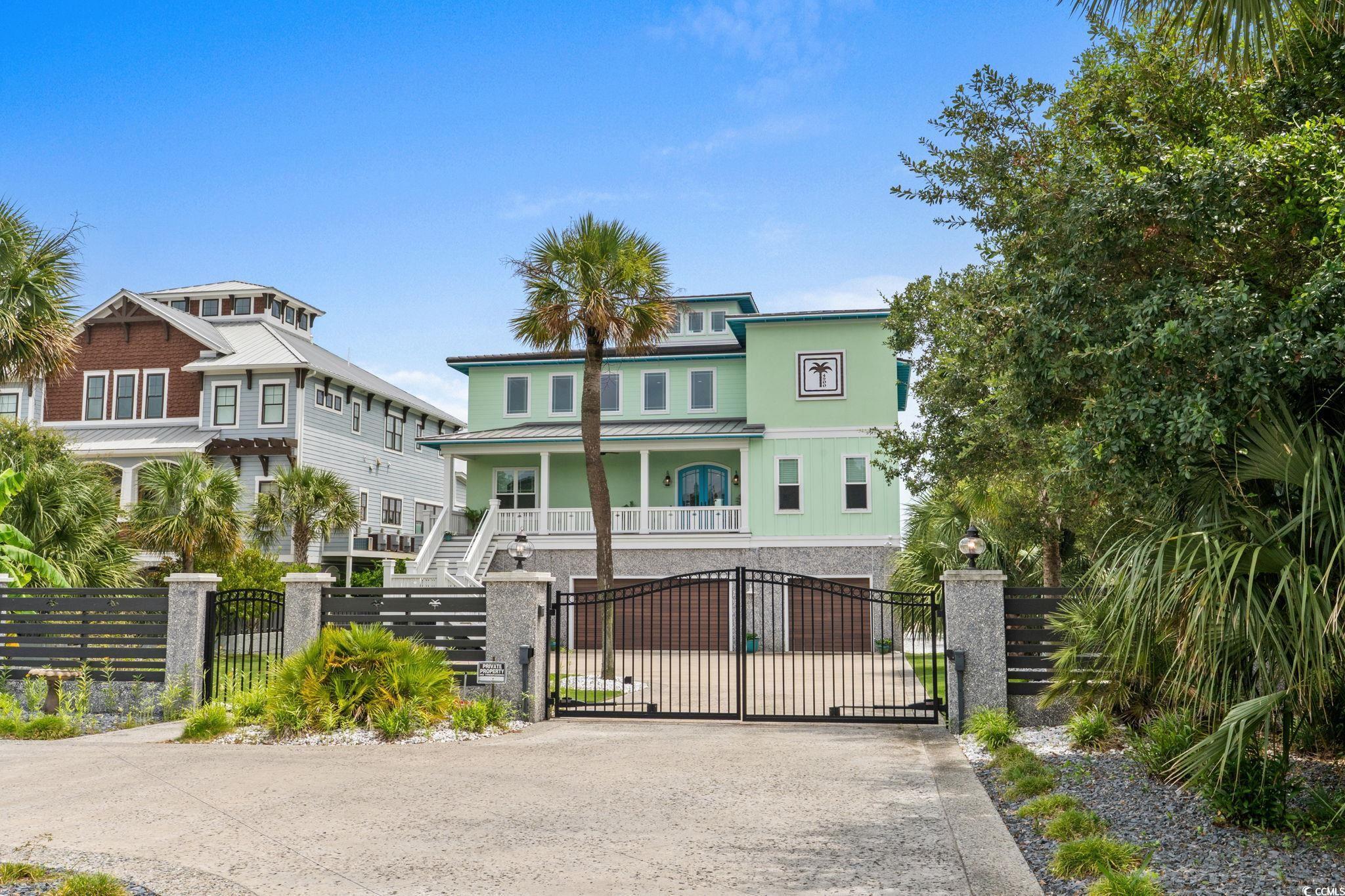 Image 2: Gate featuring a fenced front yard, stairway, and