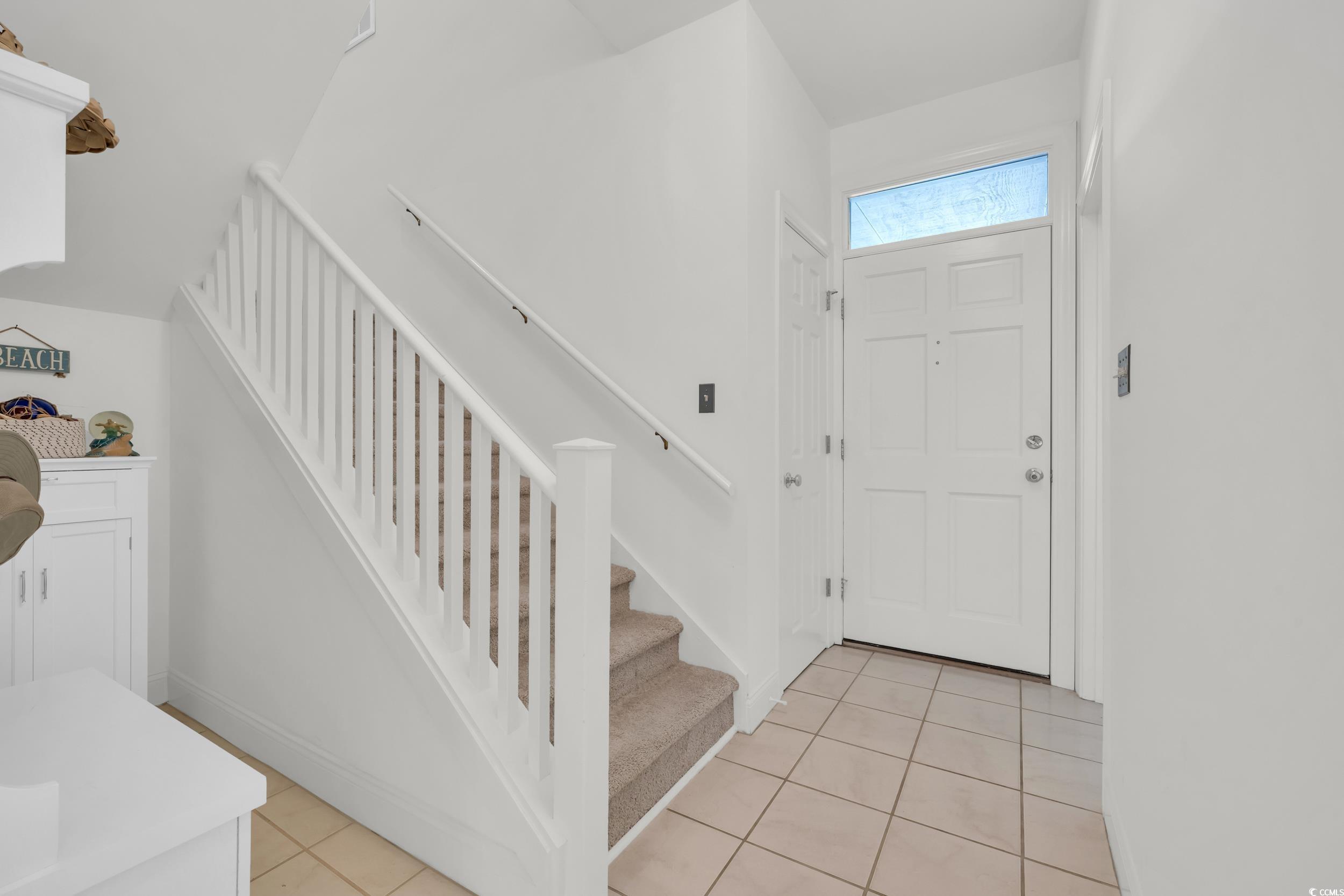 Image 4: Foyer featuring stairs and light tile patterned fl Image 4: Foyer featuring stairs and light tile patterned fl