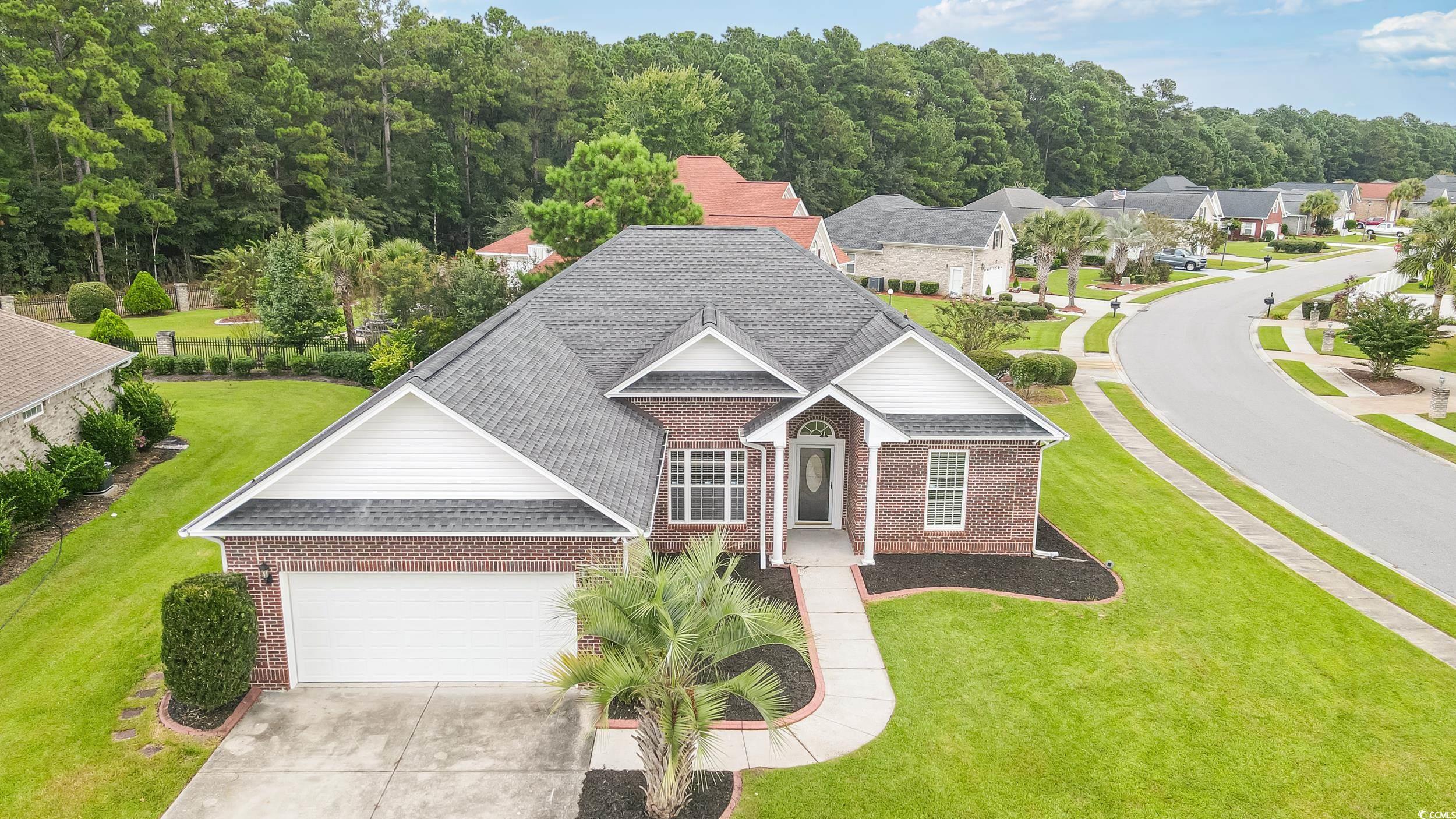 Image 4: Traditional-style home with brick siding, a shingl Image 4: Traditional-style home with brick siding, a shingl