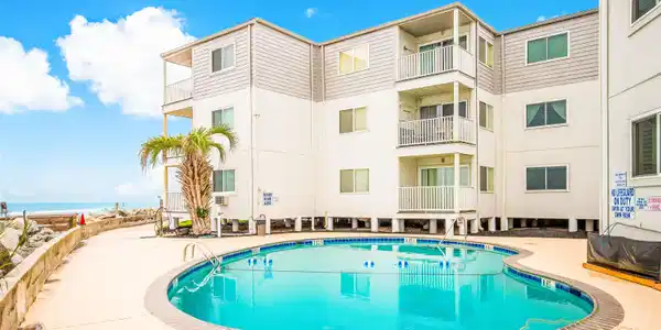 Image 2: Community pool with a patio Image 2: Community pool with a patio
