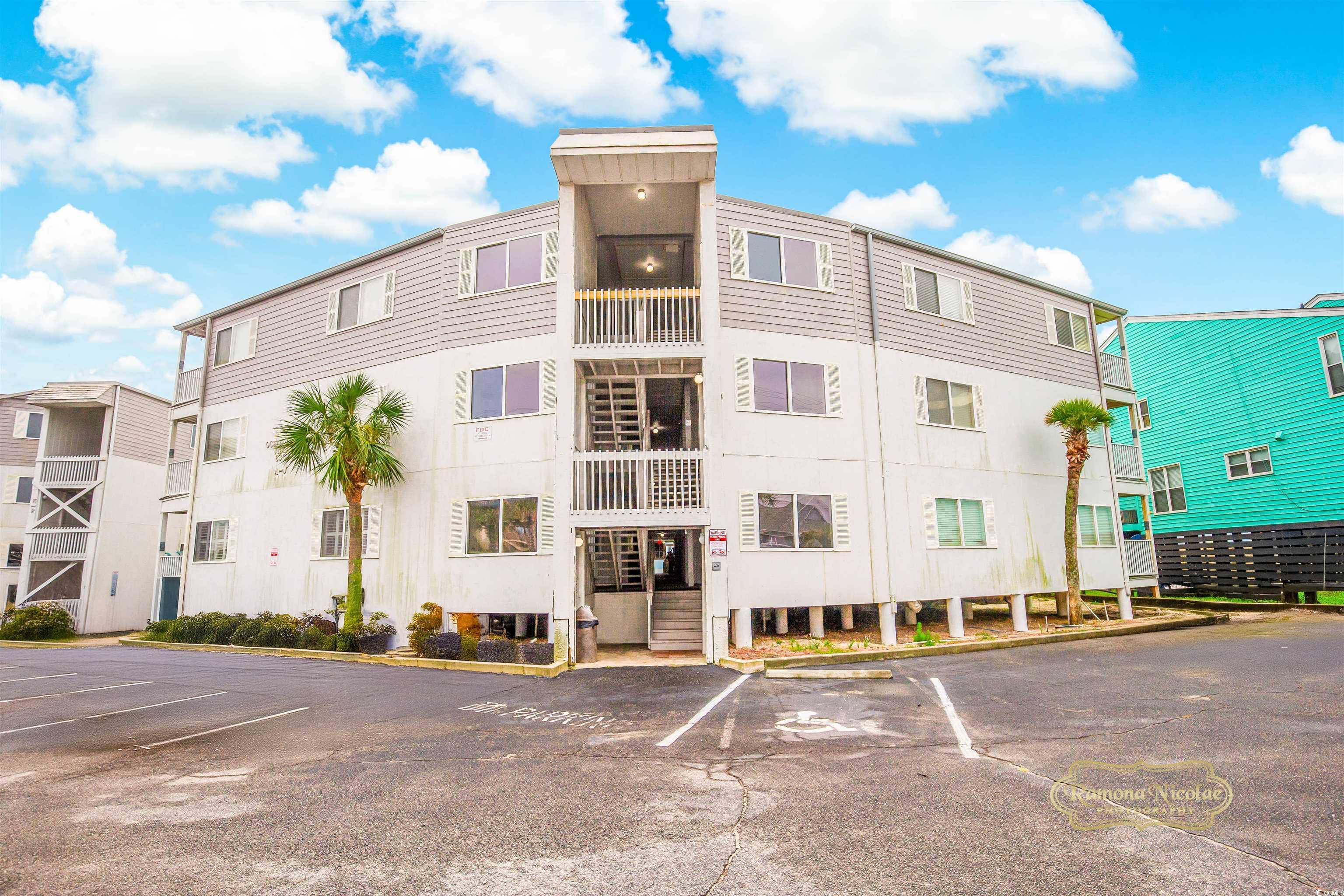 Image 3: View of building exterior featuring uncovered park Image 3: View of building exterior featuring uncovered park