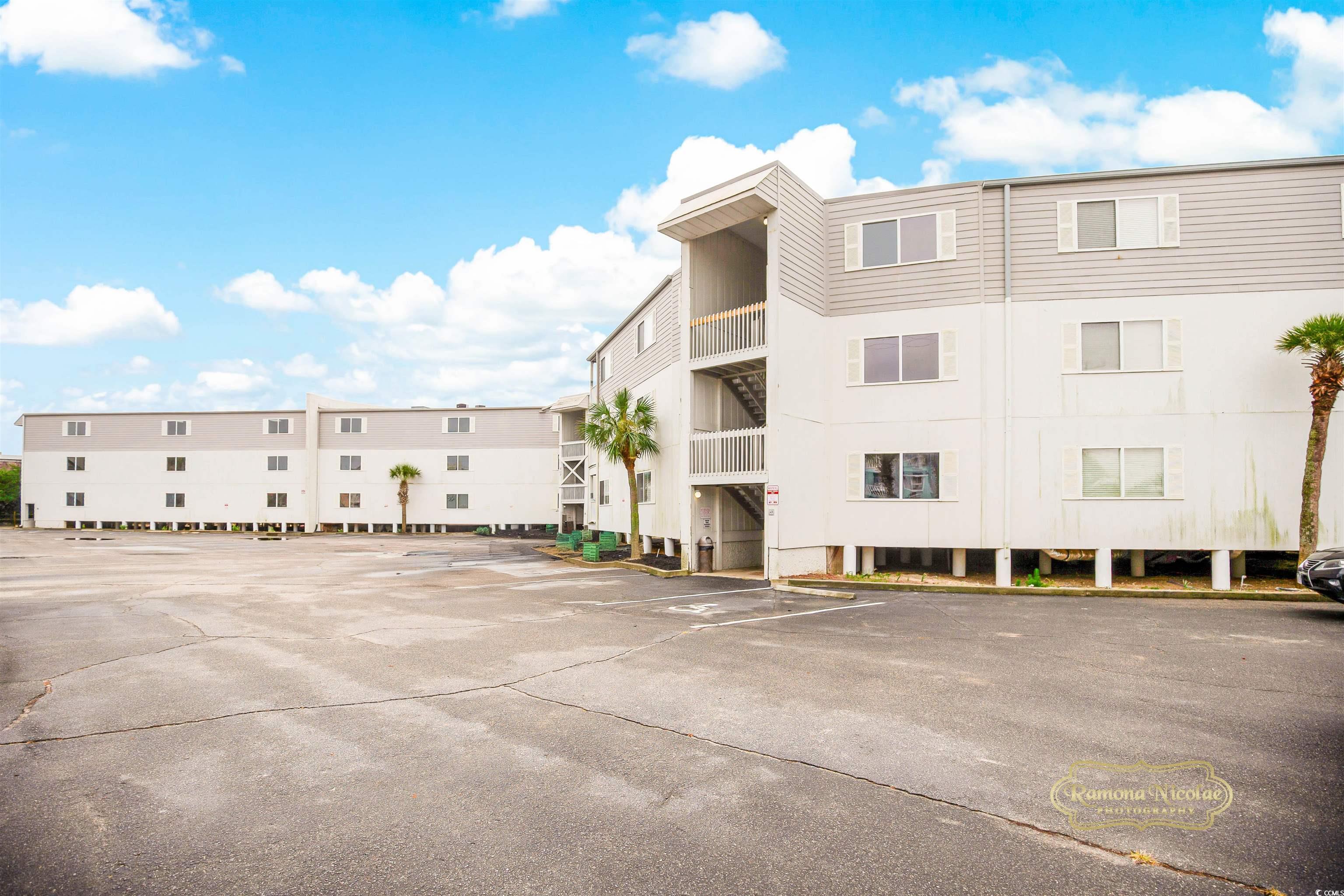 Image 4: View of apartment building / complex featuring unc Image 4: View of apartment building / complex featuring unc