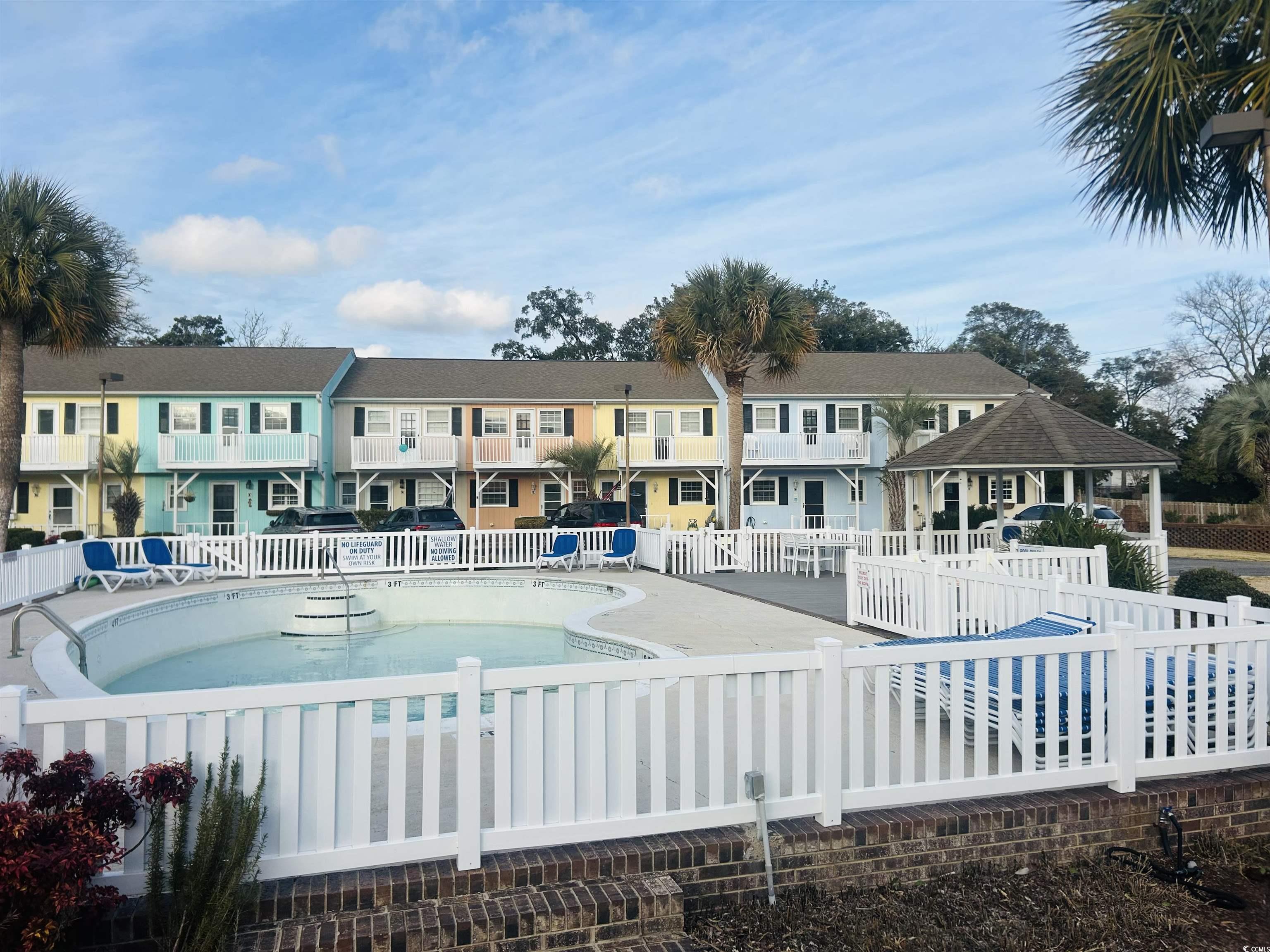 Image 2: View of pool with a patio area Image 2: View of pool with a patio area