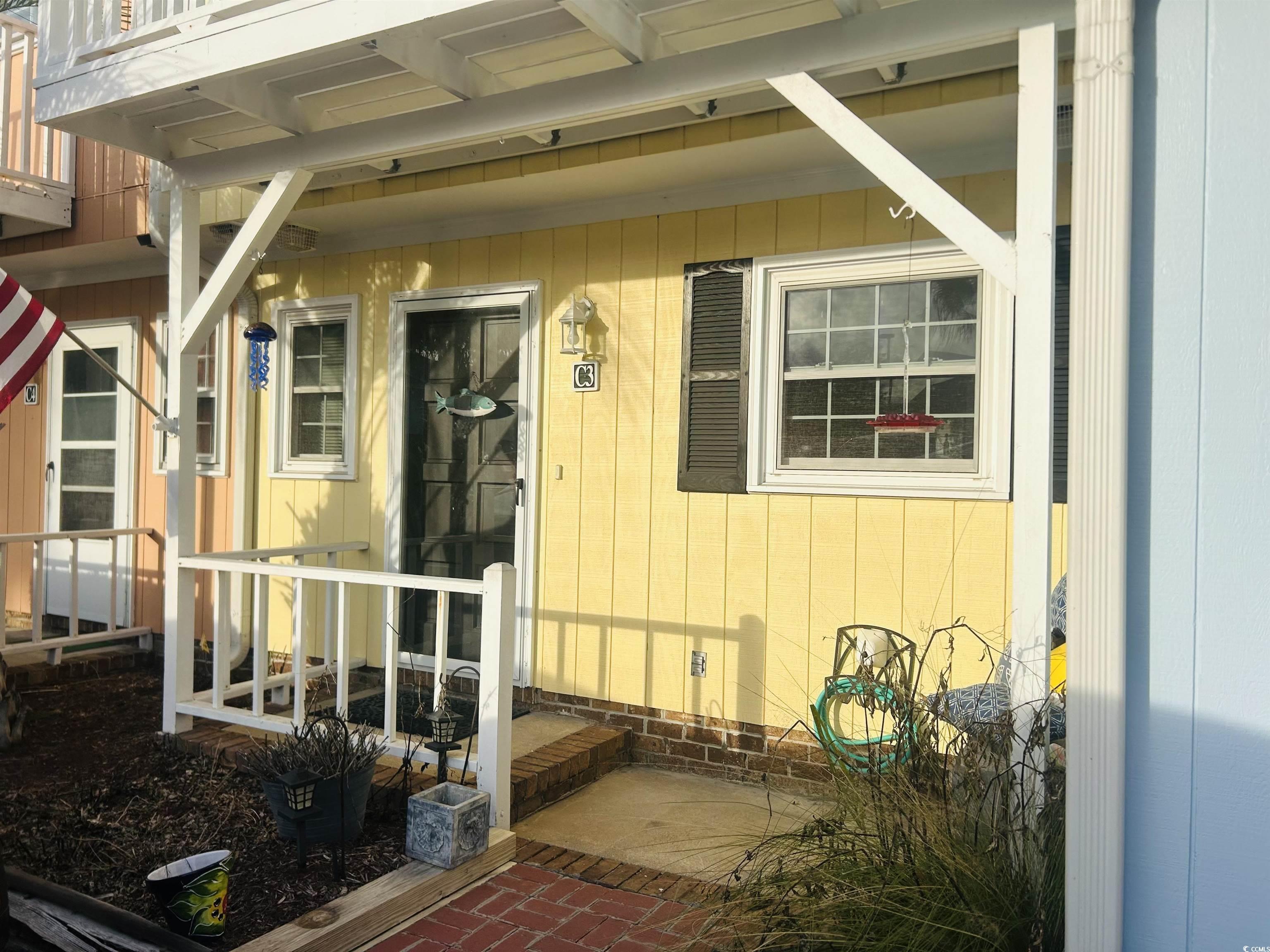 Image 4: Entrance to property with a patio Image 4: Entrance to property with a patio
