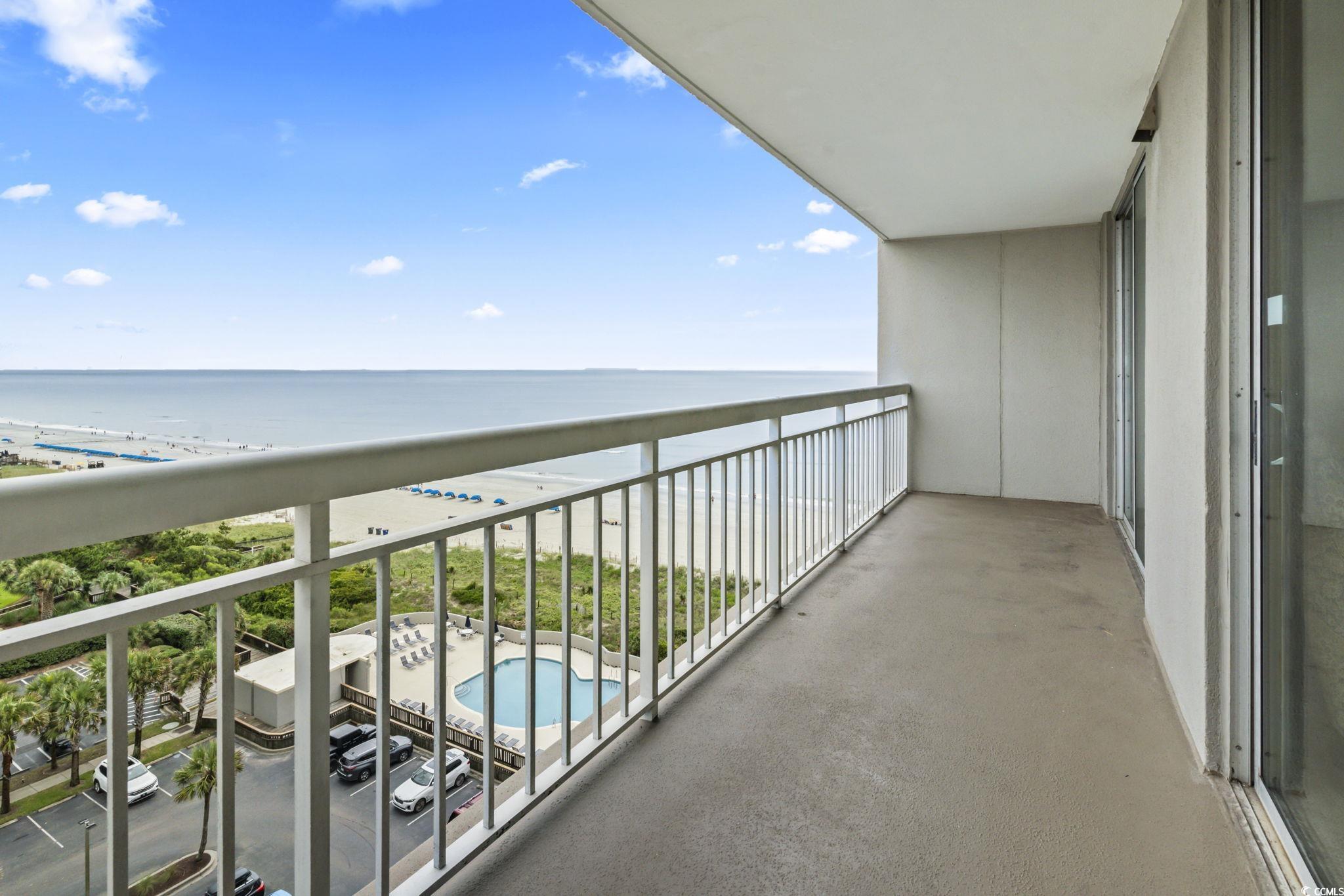 Image 3: Balcony with view of water and beach and view of p Image 3: Balcony with view of water and beach and view of p