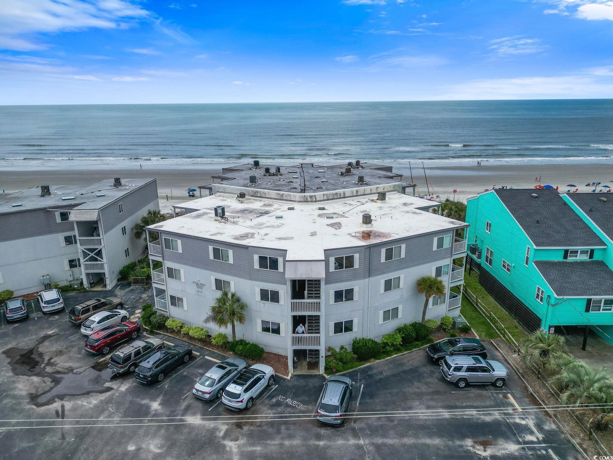 Image 2: Bird's eye view of unending shoreline and apartmen Image 2: Bird's eye view of unending shoreline and apartmen