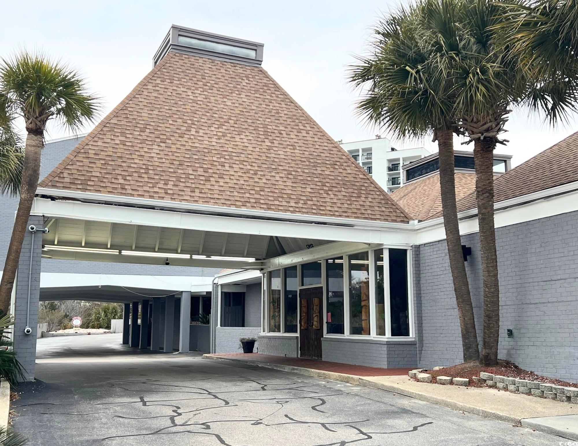Image 3: View of building exterior featuring driveway Image 3: View of building exterior featuring driveway